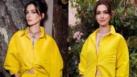 Anne Hathaway es una visión en maxivestido camisero y shorts amarillo vibrante